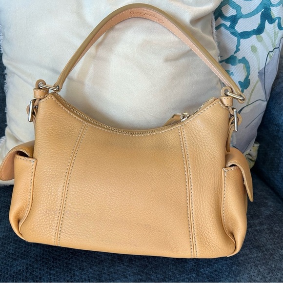 Dooney and Bourke Bag . Medium sized. Has imperfections . - Picture 16 of 17